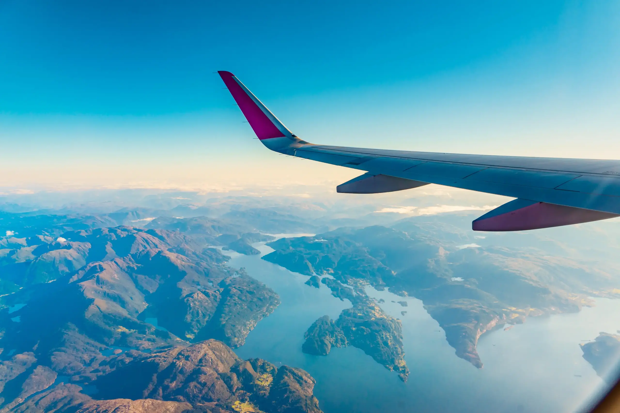 plane window view across mountainscape