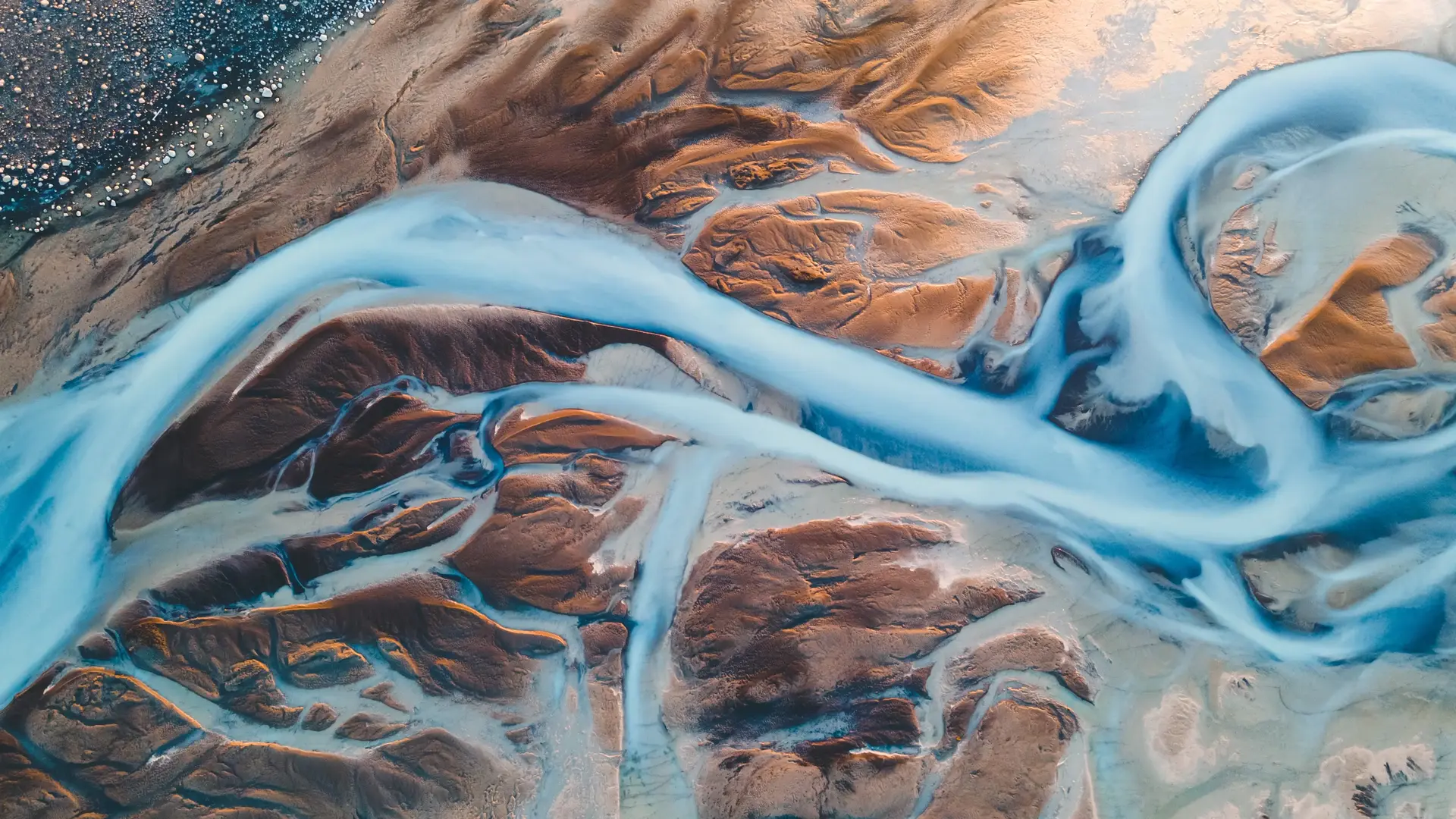 a stylised shot of rivers and mountain regions taken from space